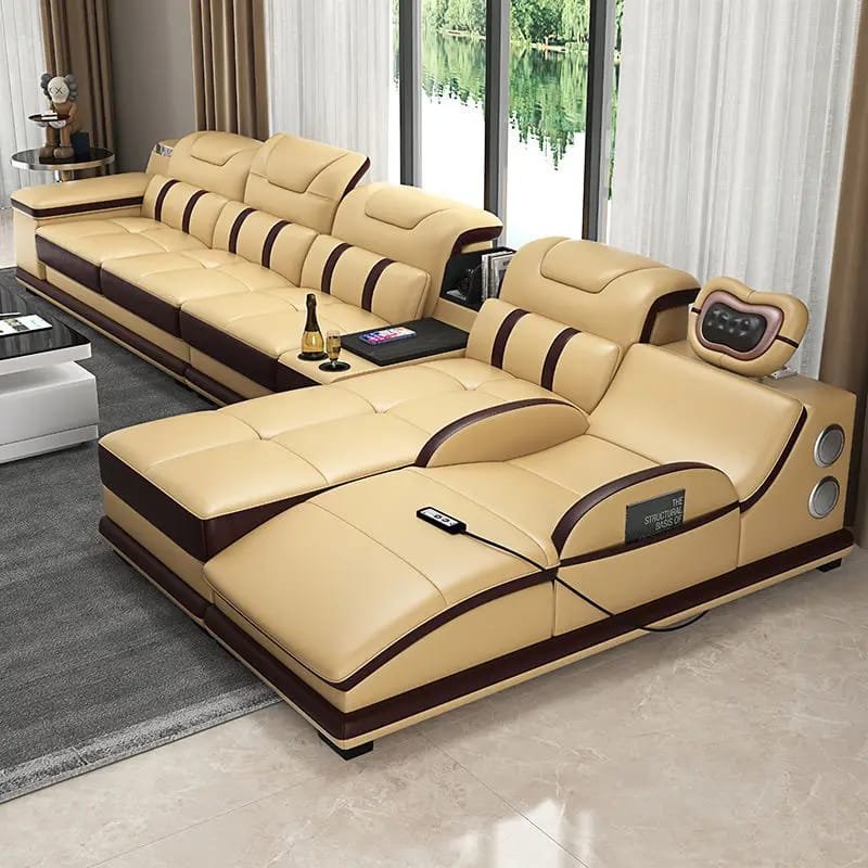 Modern Italian leather sectional couch with an ergonomic headrest, massage chaise, and Bluetooth connectivity.